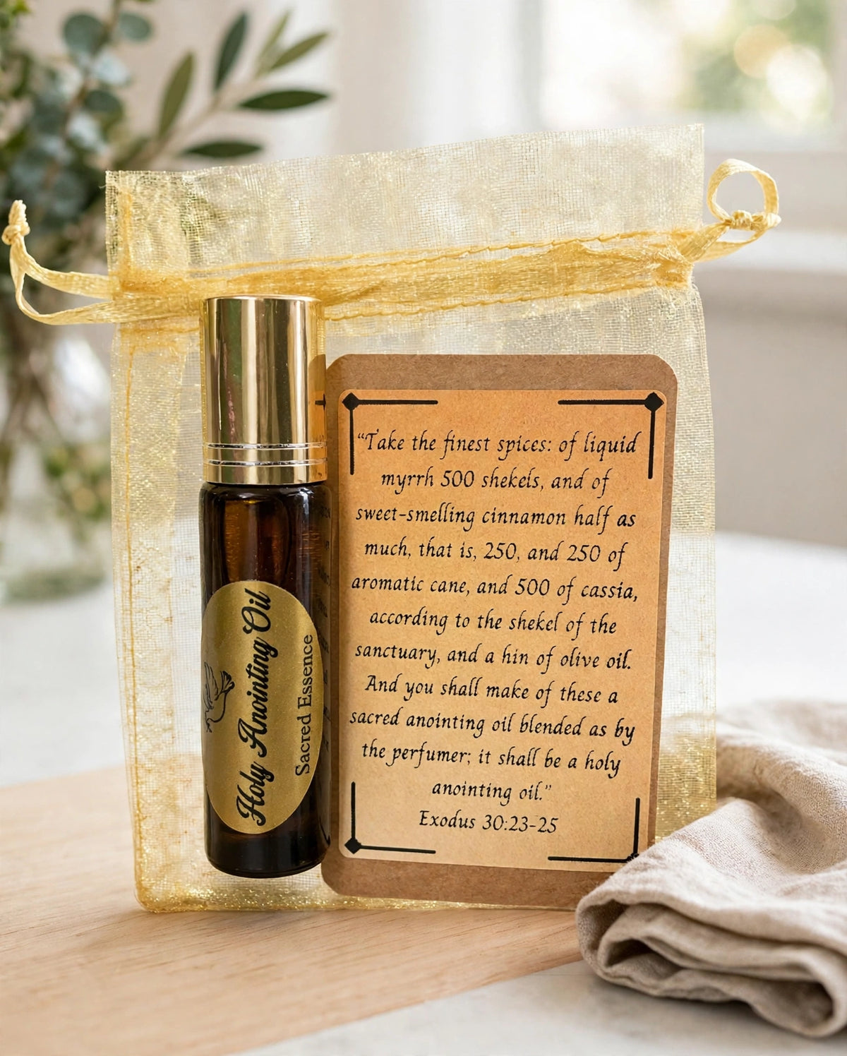 Holy Anointing Oil roller bottle in a gold organza pouch with Exodus 30 verse card